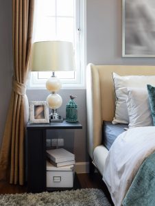 bedroom interior design with white and green pillows on white be