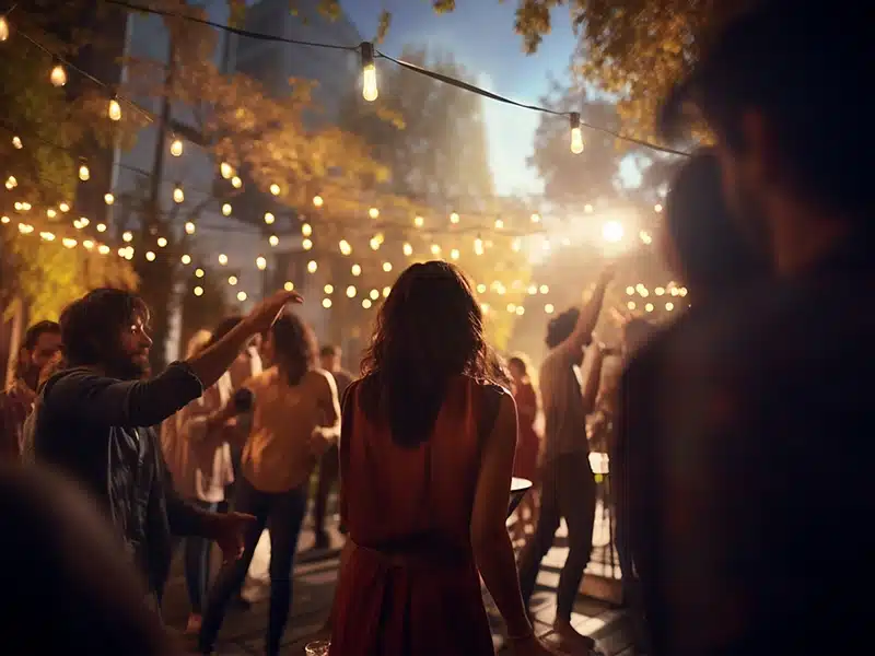 A girl walks through a crowded backyard