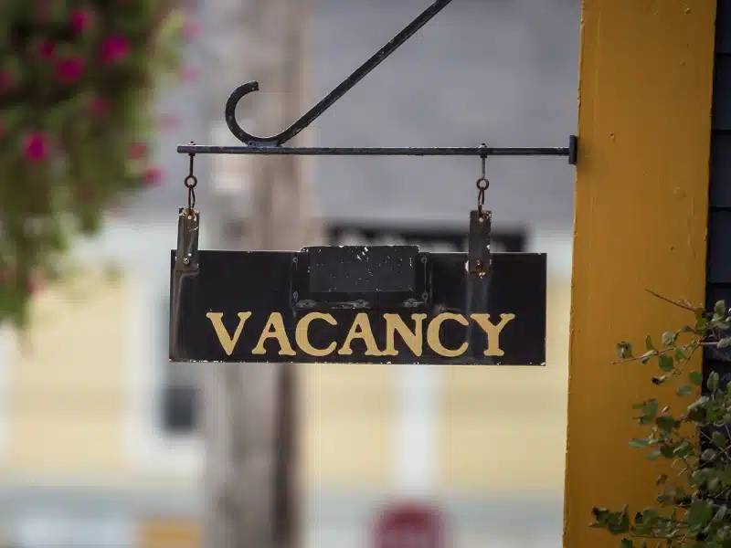 Vacancy sign outside of a historic home.