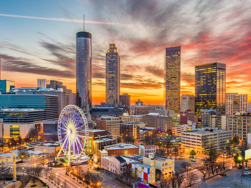 A city skyline in Georgia at sunset.