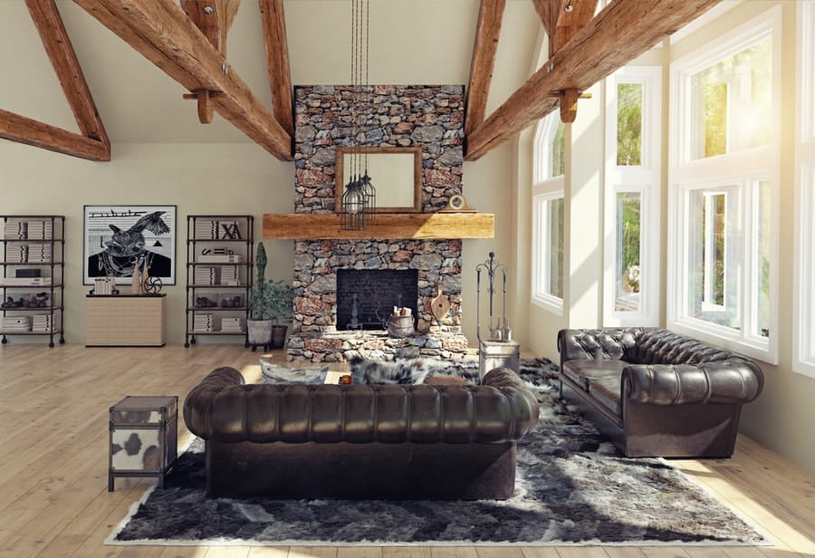 A living room in an Airbnb with a stone fireplace