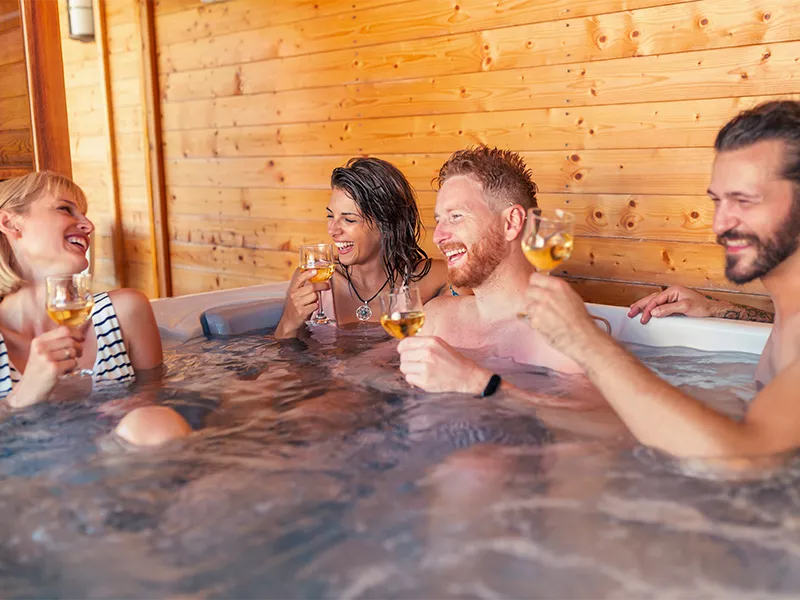People sit in the hot tub of at Airbnb