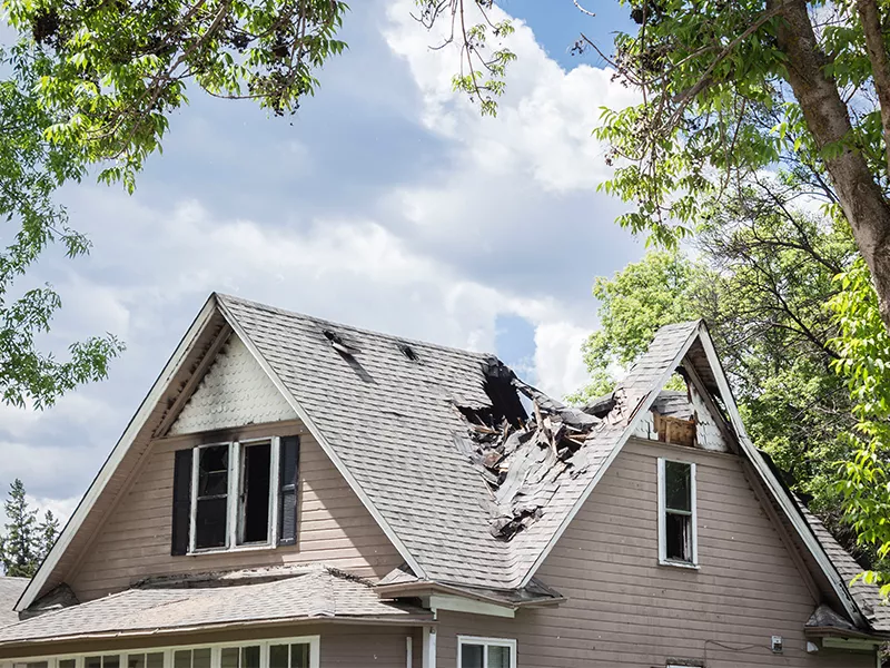 Roof of a house burned and collapsed needs vacation rental property insurance