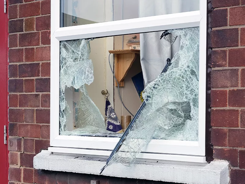 A broken window of a home