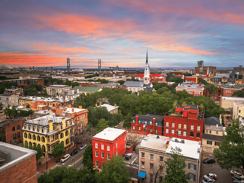 A sunset picture of downtown historic Georgia, with various buildings and shops.