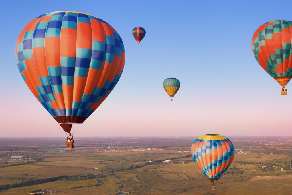 A picture of an orange and blue hot air balloon.