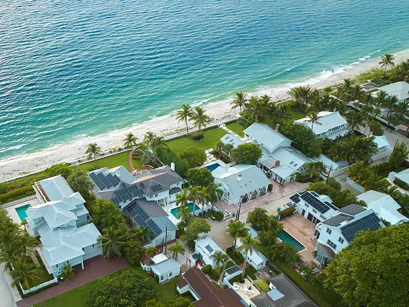 An aerial of beachfront Florida short-term rental homes. 