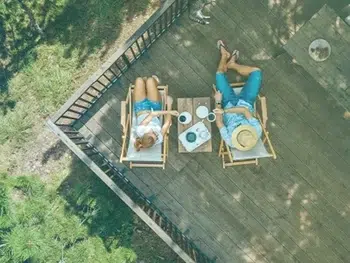 Young Couple Enjoy A Relaxing Morning At Their Vacation Rental