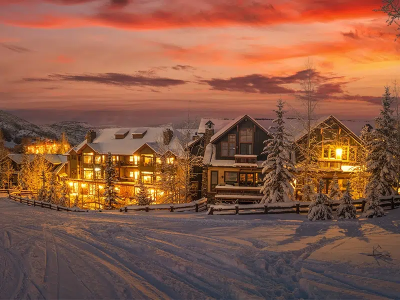 Snow covered homes at sunrise in Alaska