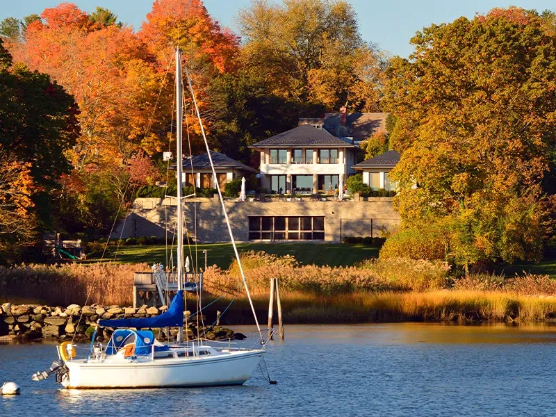 A sailboat on the water outside of a home in Connecticut