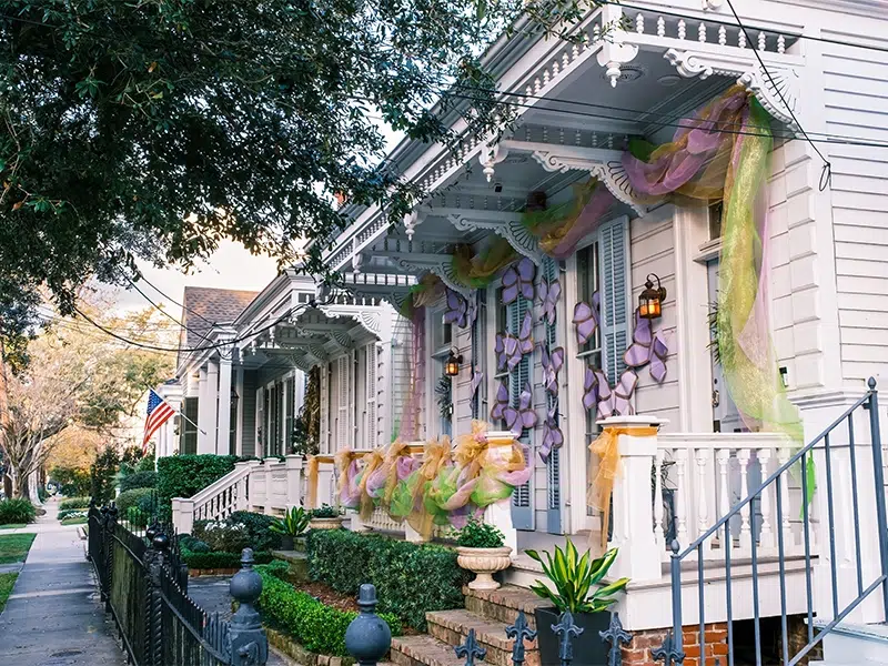 A front porch in Louisiana decorated for mardi gras